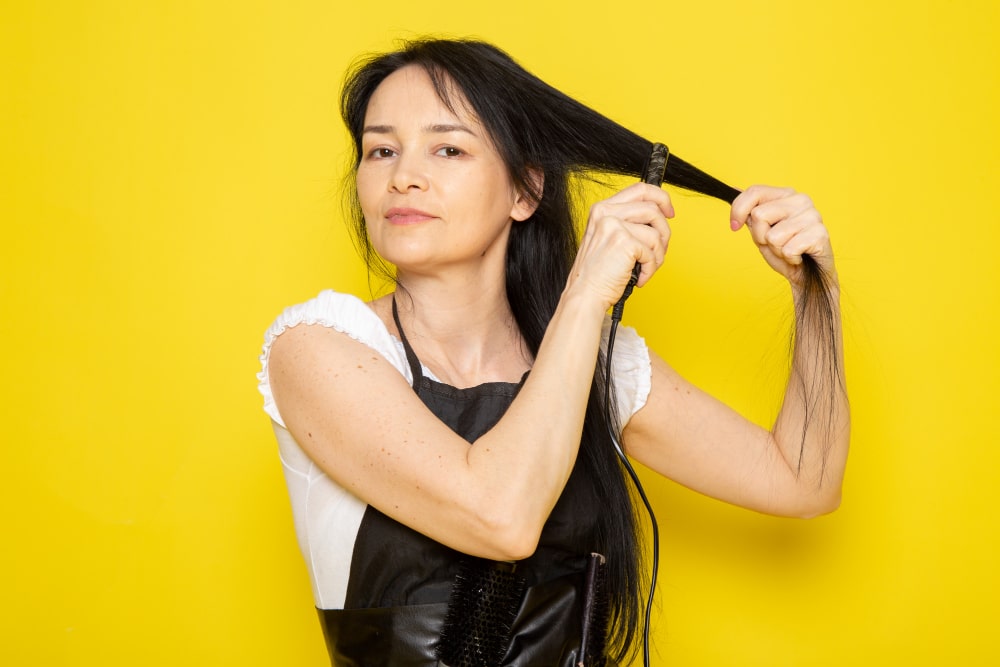 “100% real human hair tape-in extensions – straight texture, natural black color”