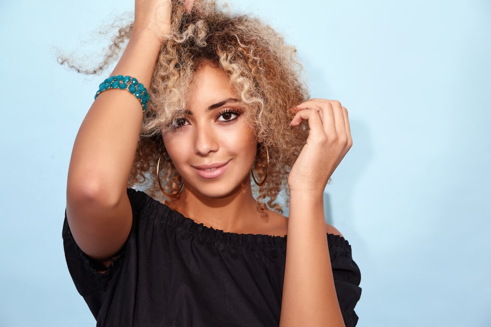 Beautiful woman wearing a natural-looking closure wig – perfect blend of style and scalp protection